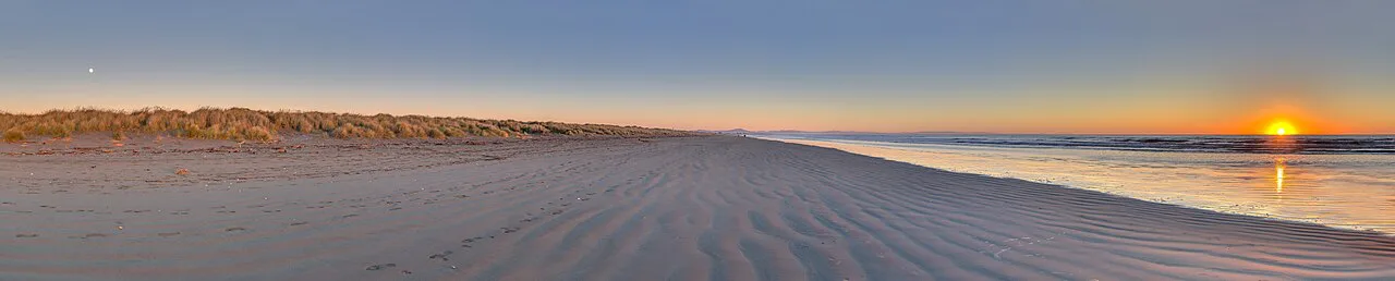 The sun and the moon in South New Brighton's beach, New Zealand, Brighton